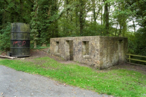 Fig 25: James Watt Cottage and Graffitied Steam Engine Cylinder (Canmore)
